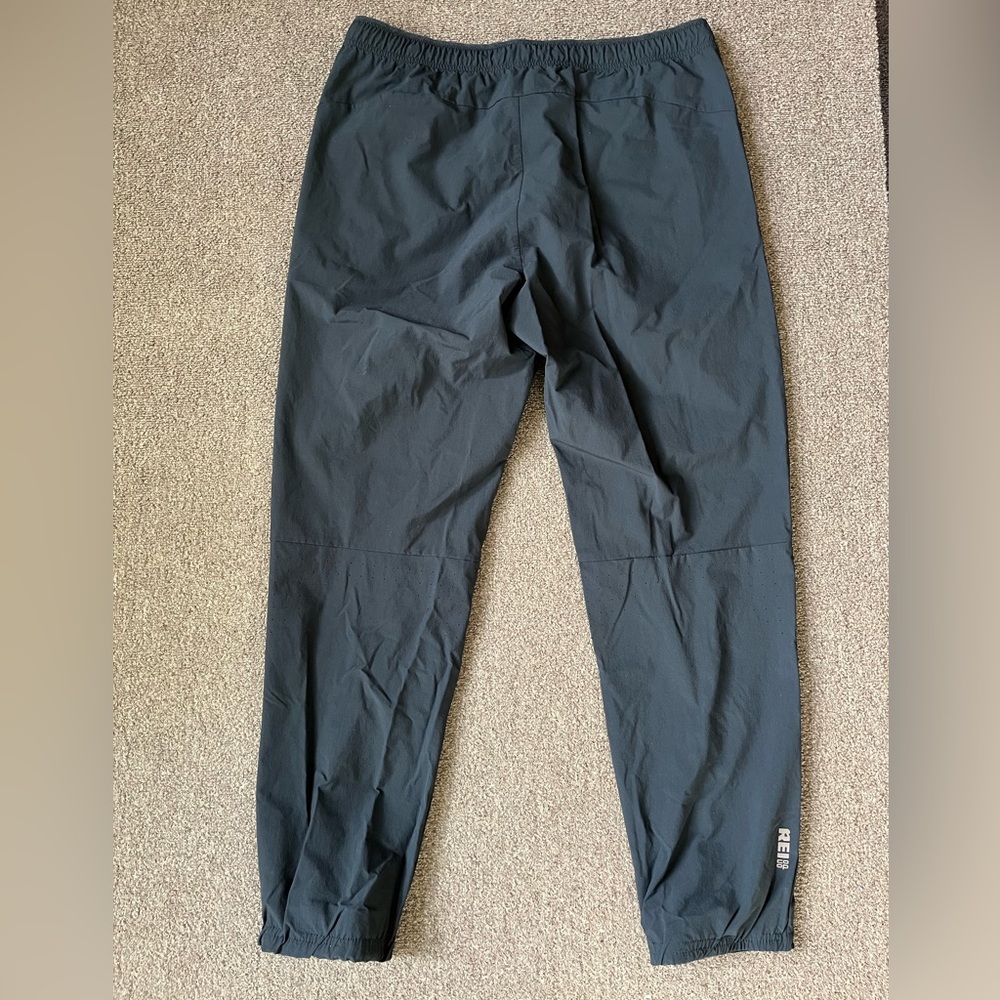 REI black running pants. Light weight, zipper pockets. Medium size.